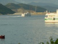 DB ferries - with the Penny Bay reclamation in the background.  Penny Bay is the new location of Disneyland - Hong Kong.  Two months ago none of the land fill was there!