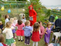 Po entertaining the children at Livy (3) and Ted's (2)  birthday party