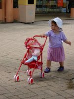 Sunday morning in the Plaza with my new high chair and rag doll.