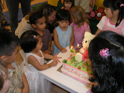 Lauren cutting her cake.