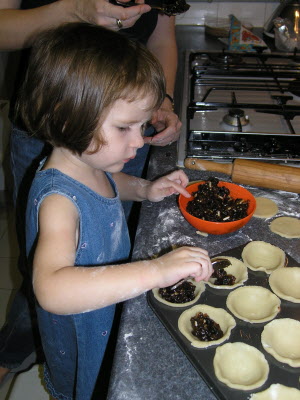 Lottie making mince pies.