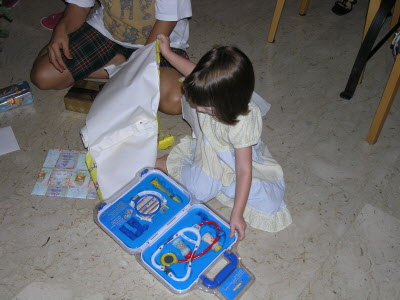 Lottie opening the Doctor's set from Jo.