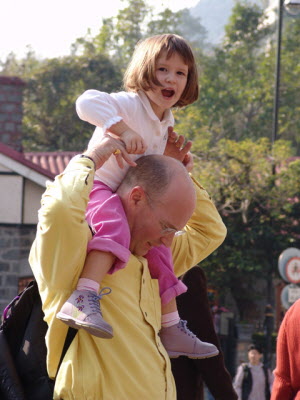 On Daddy's shoulder.
