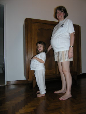 A real pregnant Mummy and a pretend pregnant Mummy.