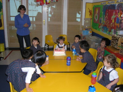 Blowing out the candles.