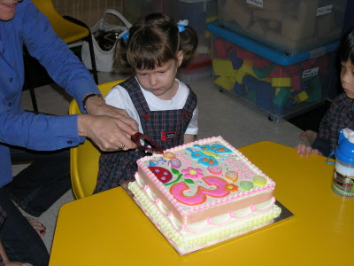 Cuttin my cake.
