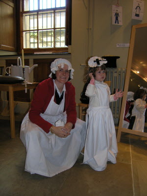 Dressing up in the kitchen of Harwood House.
