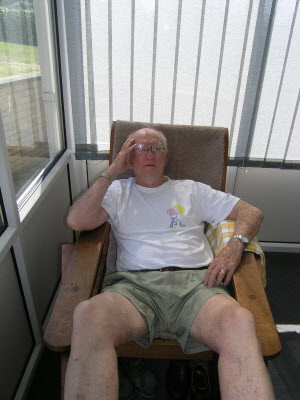 Dad relaxing in the long chair.