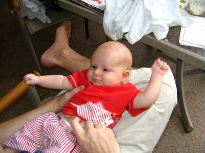 Conrad on Peter's knee.