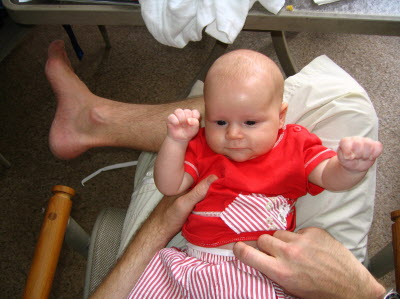 Conrad on Peter's knee.