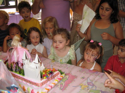 Isabella blowing out her birthday candles.