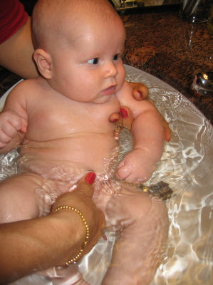Jo washing Conrad in the basin at the hotel in HK.
