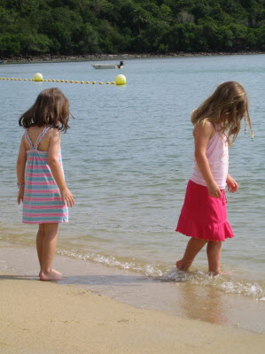 Lottie & Poppy playing in the surf before supper.