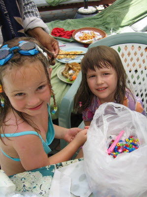 Lottie having some beads like Poppy.