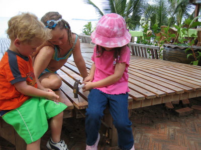 Lottie learning to use a hammer.