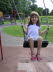 Lottie enjoying the swings