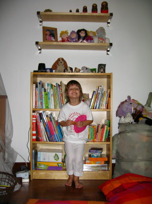 Lottie and her new shelves.