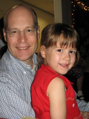 Lottie and Daddy at the class Christmas sing-along.
