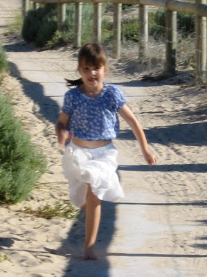 Lottie having fun running along Prevelly beach.