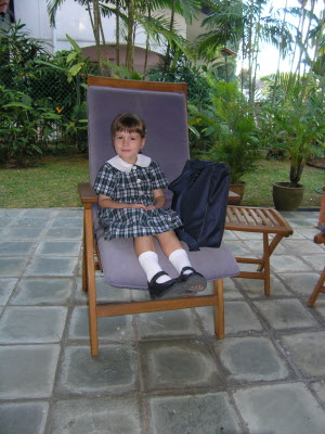 Lottie waiting for her bus in the front porch.