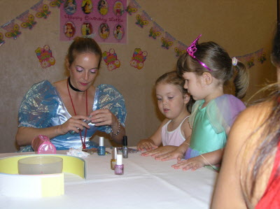 Princess Caroline painting nails for Molly and Lottie