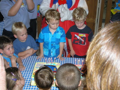 Jason and Lewis - blowing out their candles.