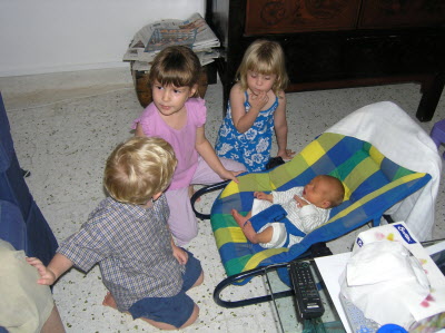 Joshua Lottie and Olivia playing with Conrad.