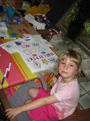 Olivia and Lottie making specail T shirts for thier 100 day school day party.