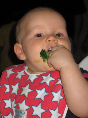 This boy loves brocolli.
