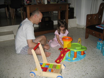 Playing with Conrad's toys.