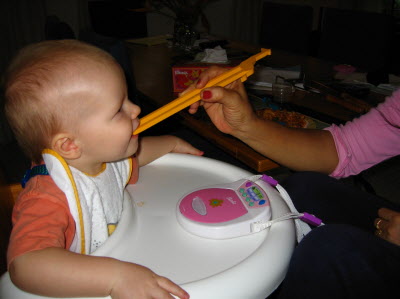 Lottie was using chop sticks - so Conrad wanted to use them too.