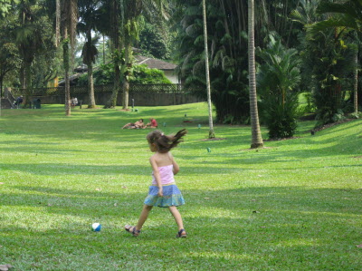 Lottie and Conrad playing ball in the Botanical gardens.