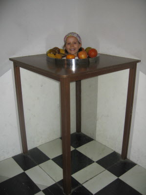 Lottie's head in a platter of fruit.