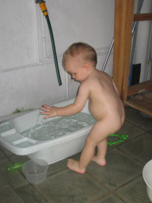 Conrad playing outside with water...