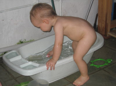 Conrad playing outside with water...