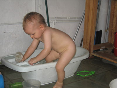 Conrad playing outside with water...