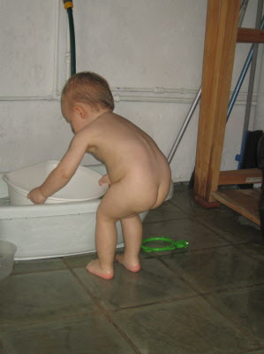 Conrad playing outside with water...