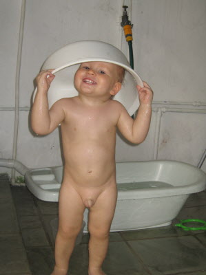 Conrad playing outside with water...