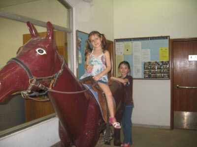 Lottie and Madeline at the HK jockey club riding school/