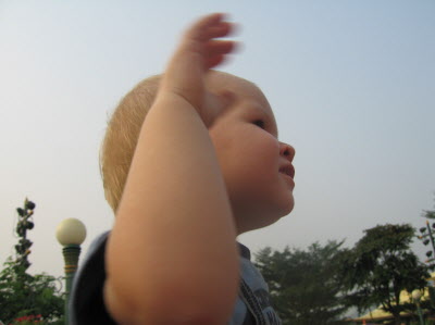 Waving to the floats.