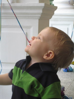 Having a ball with the balloons.