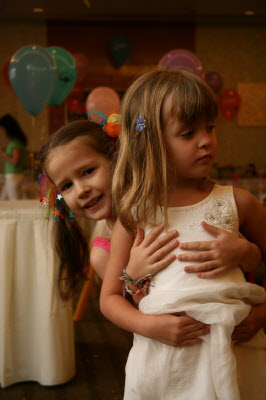Lottie and Olivia squeeze onto an island