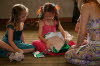 Lottie unwraps a layer with Ellie