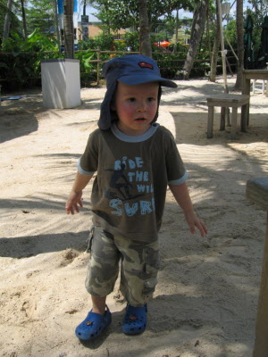 Conrad playing on the beach at Sentosa.
