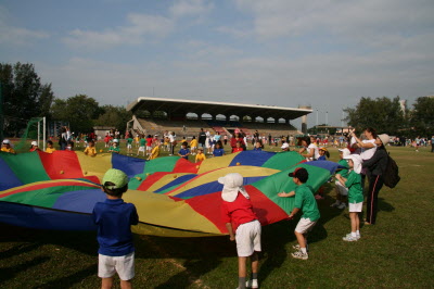 Juggling with a parachute.