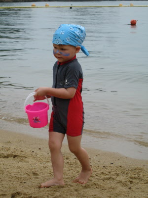 Conrad playing the sandy beach.