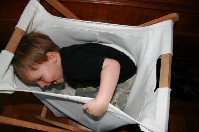 Conrad hiding in the dirty clothes basket!