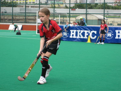 Lottie playing for Valley under 8s Hockey Team.
