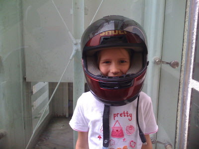 Lottie with Colleen's red helmet.