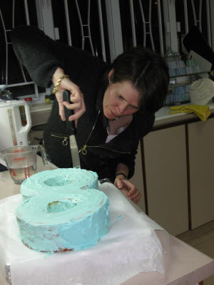 Susan icing the cake